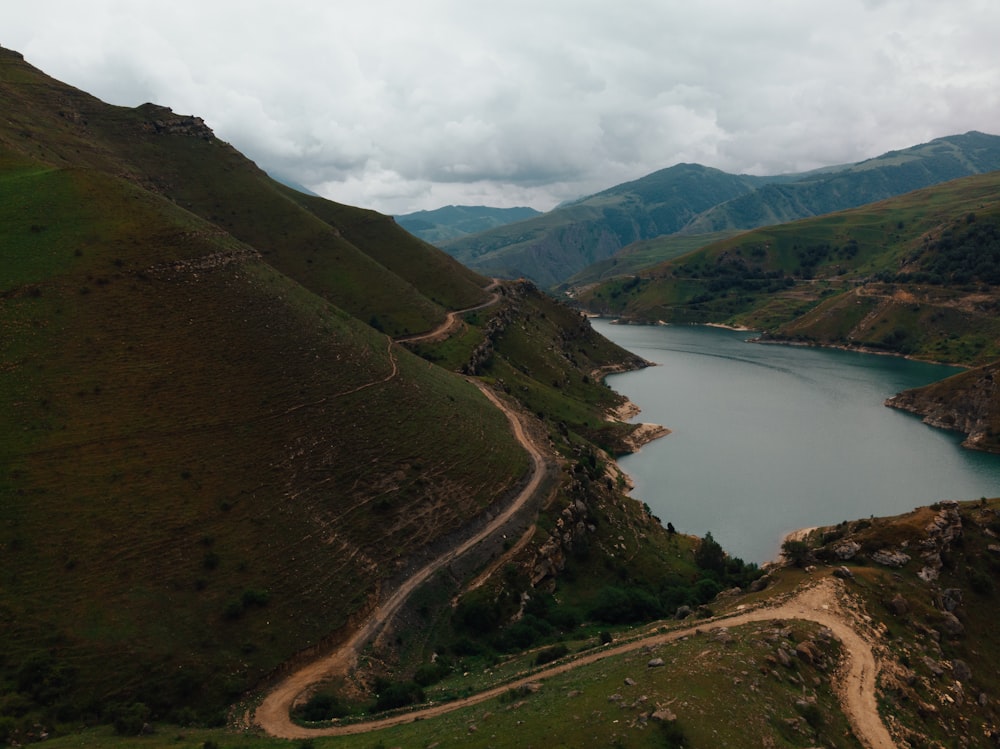 a scenic view of a body of water surrounded by mountains