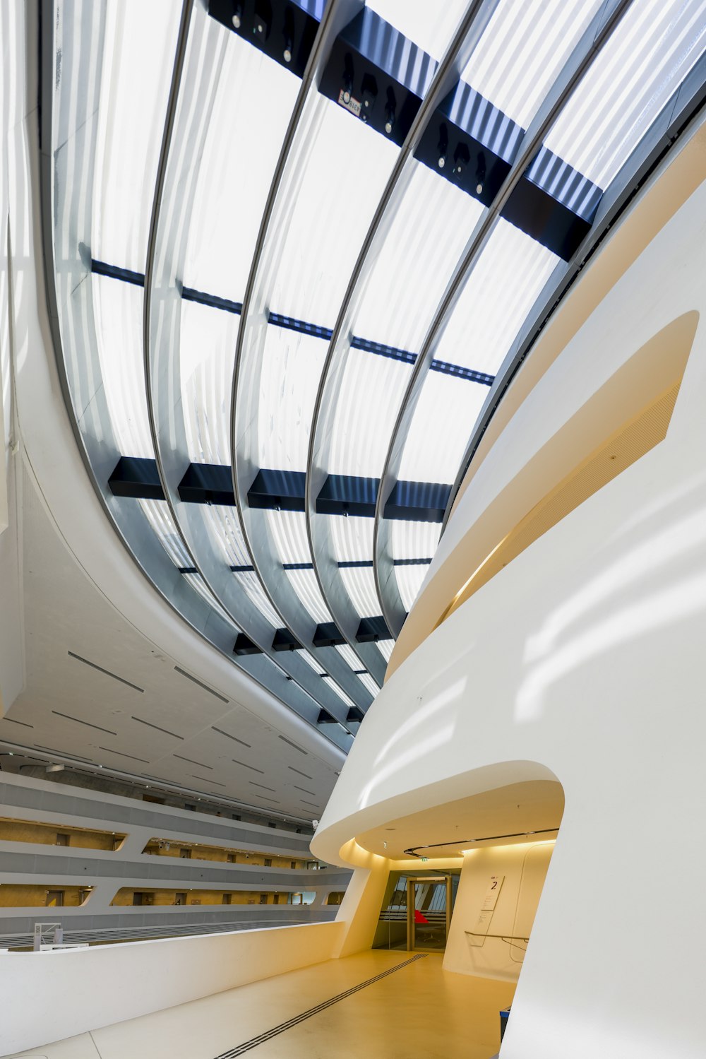 a large white building with a skylight above it