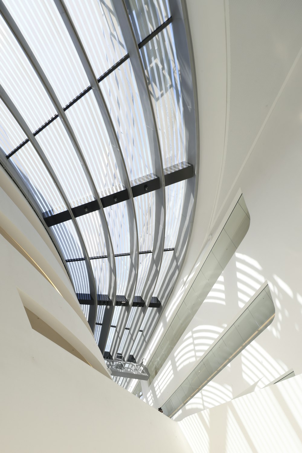 a white room with a skylight and a ceiling