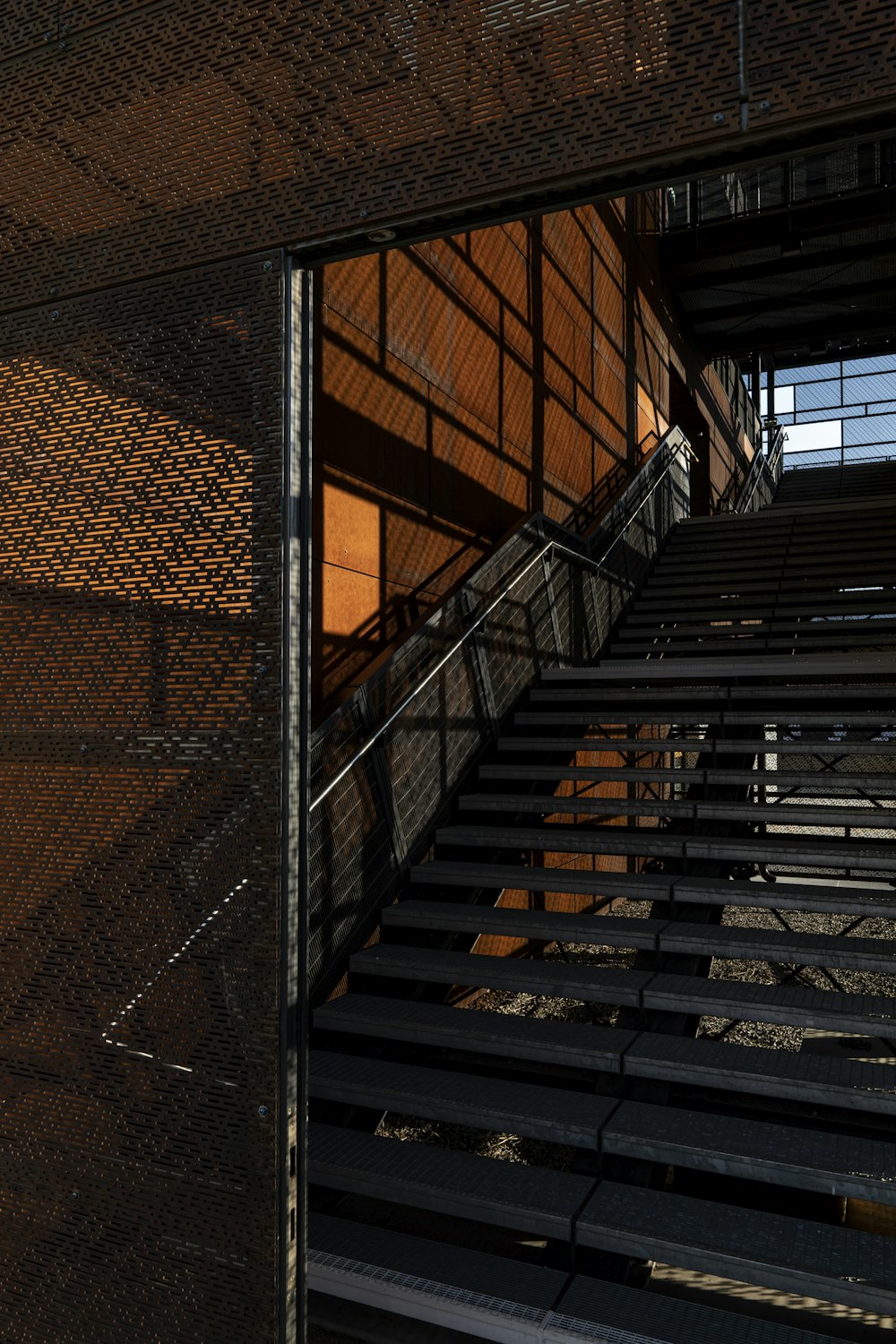 a metal staircase going up to a building