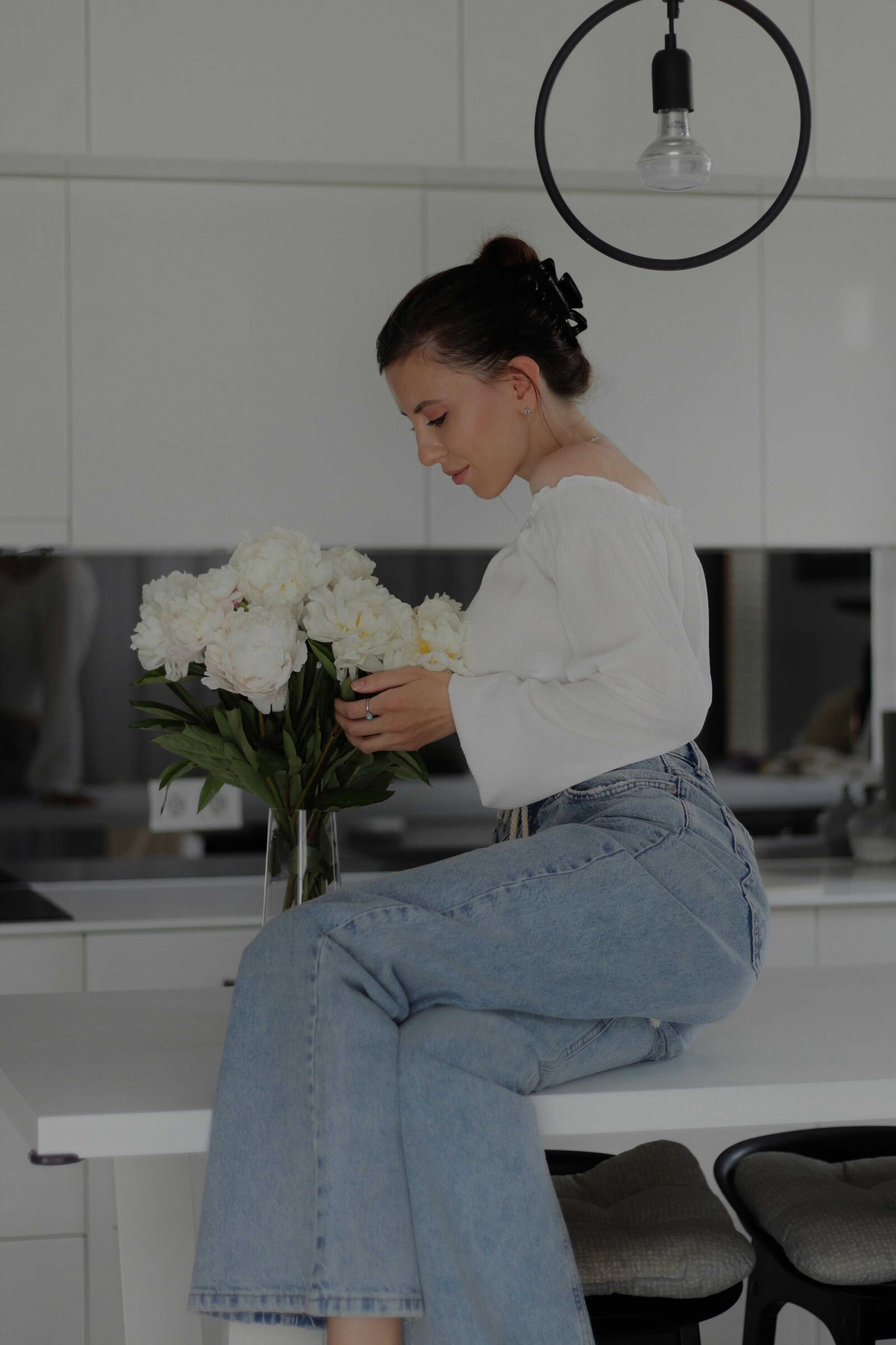 Person creating a DIY flower arrangement showing DIY flower arrangement cost in practice
