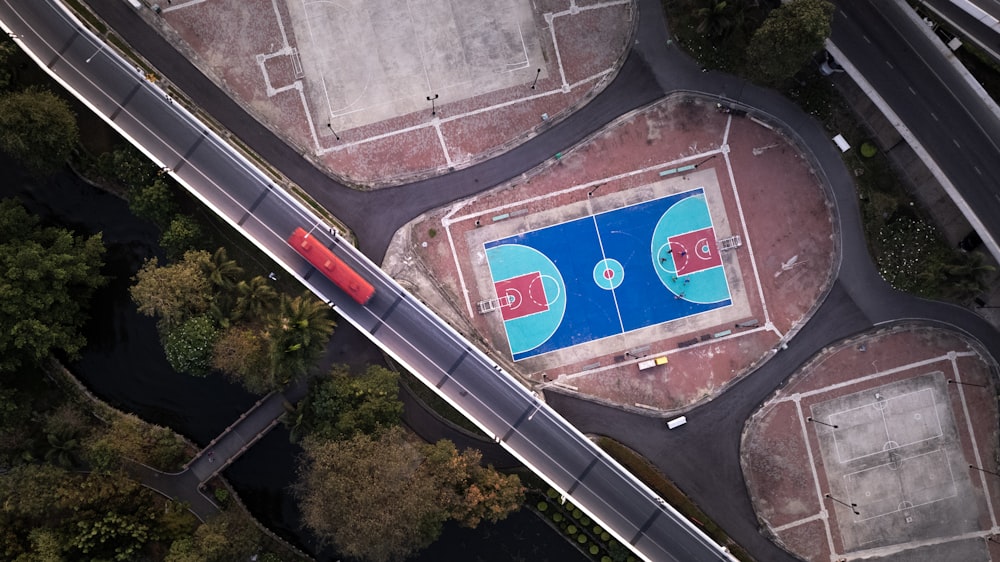 an aerial view of a basketball court in a park