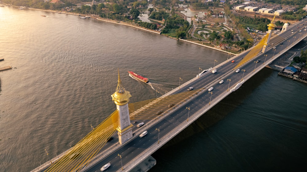 an aerial view of a bridge over a body of water