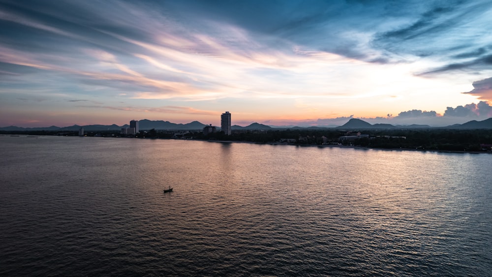 a body of water with a boat in the middle of it