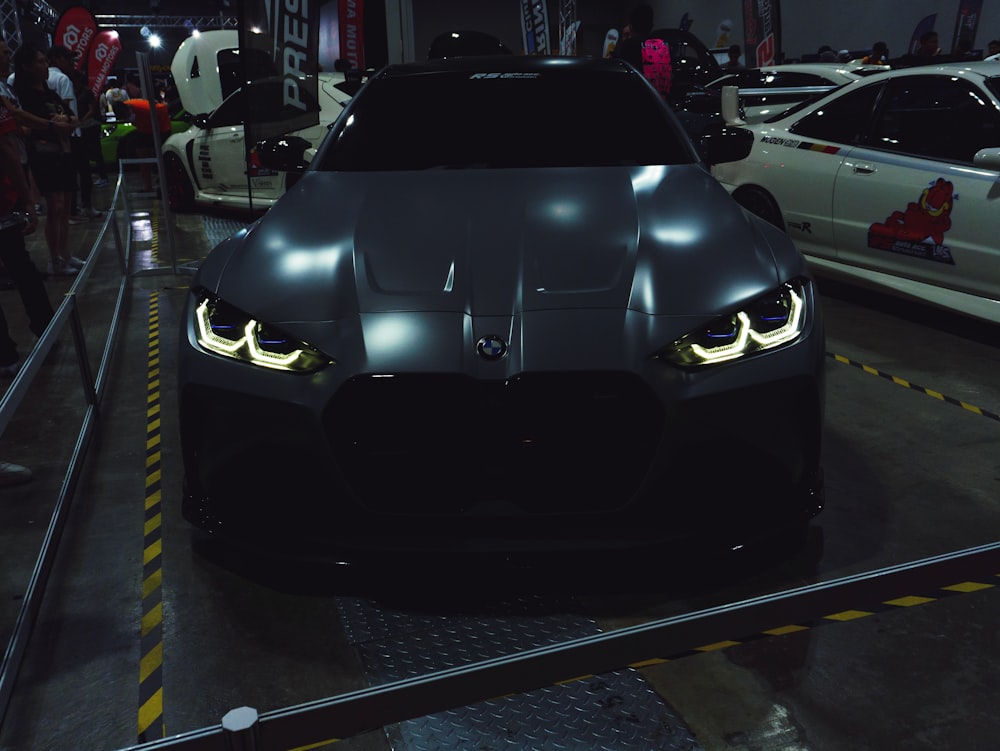 a black sports car parked in a garage