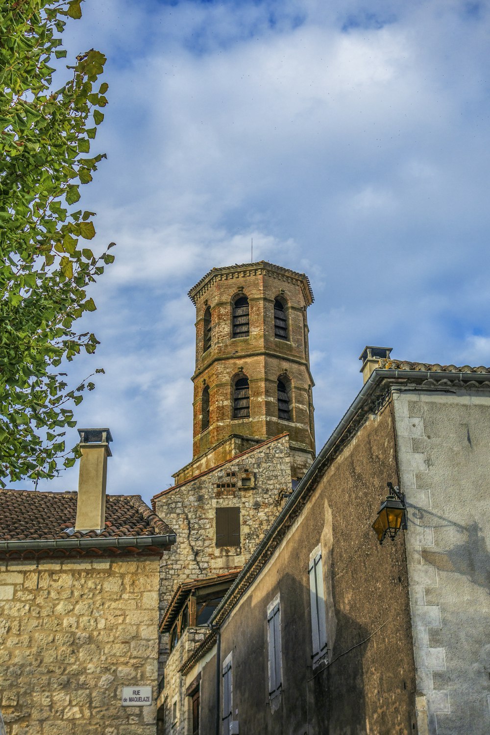 a tall tower with a clock on the top of it