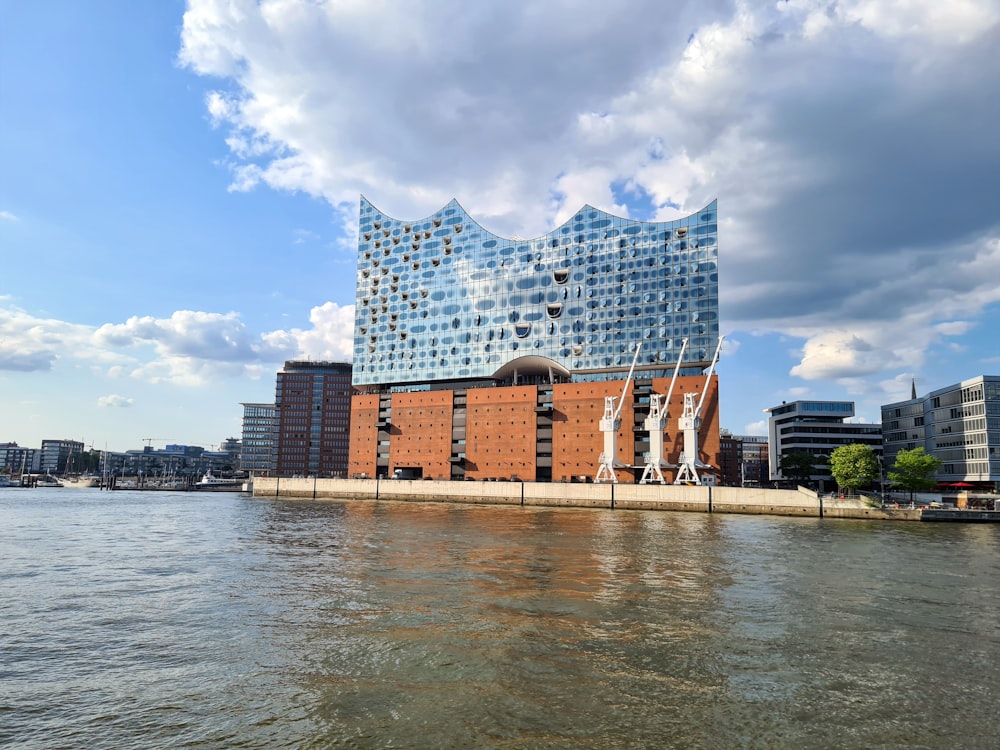 a body of water with a building in the background