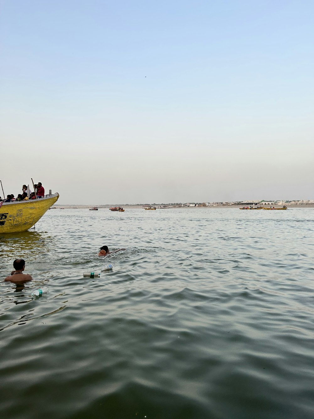 a group of people swimming in a body of water