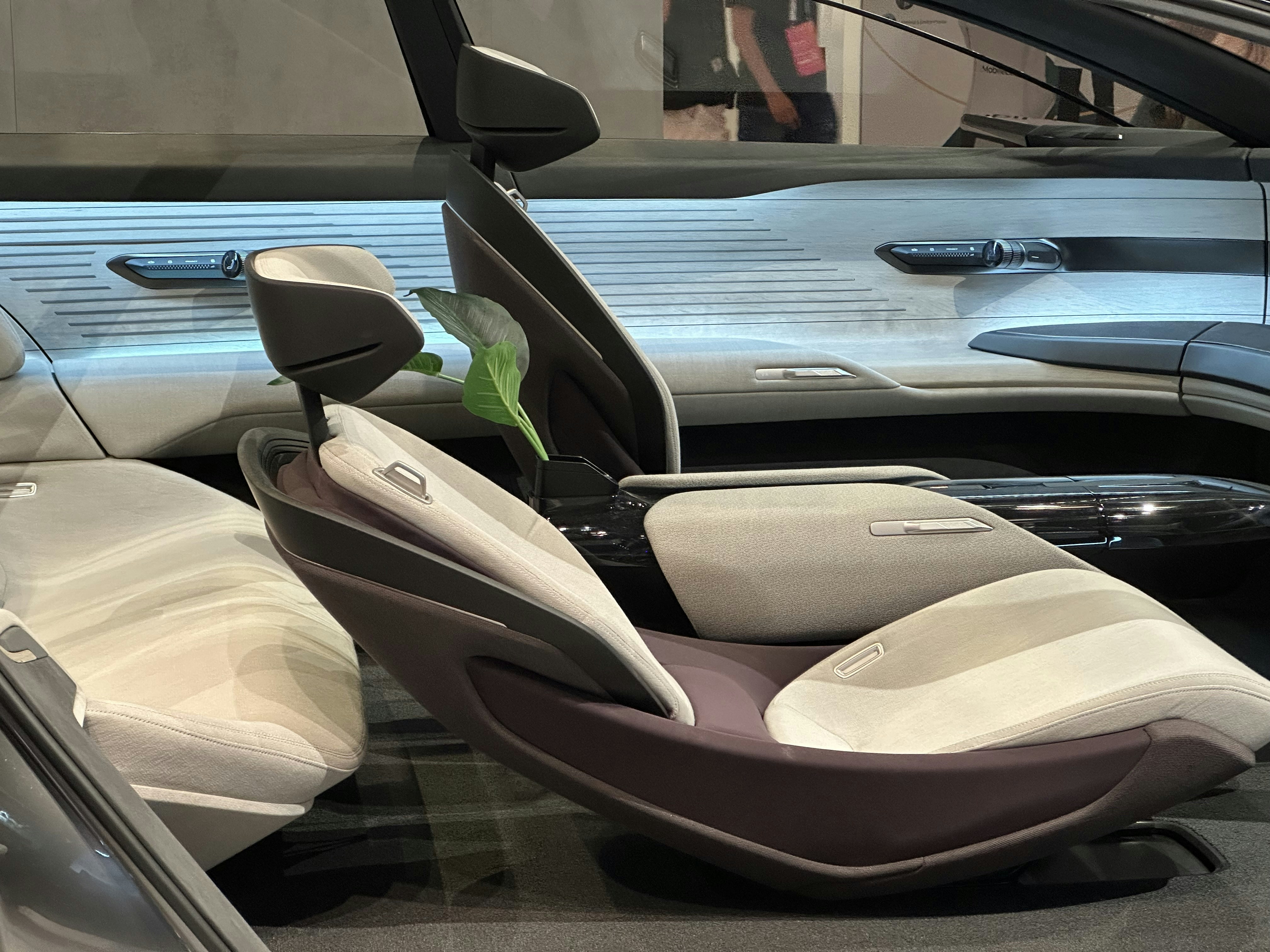 Car interior detailing close-up of clean dashboard and console, neutral gray tones
