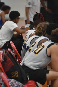 a group of young men sitting next to each other