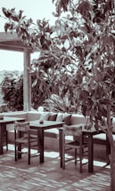 A welcoming contact page with outdoor furniture in a serene setting.