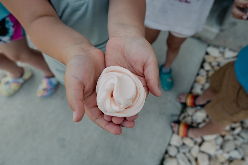 a close up of a person holding something in their hands