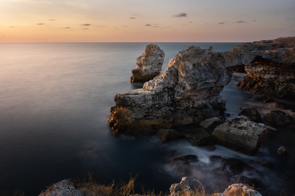 a large body of water surrounded by rocks