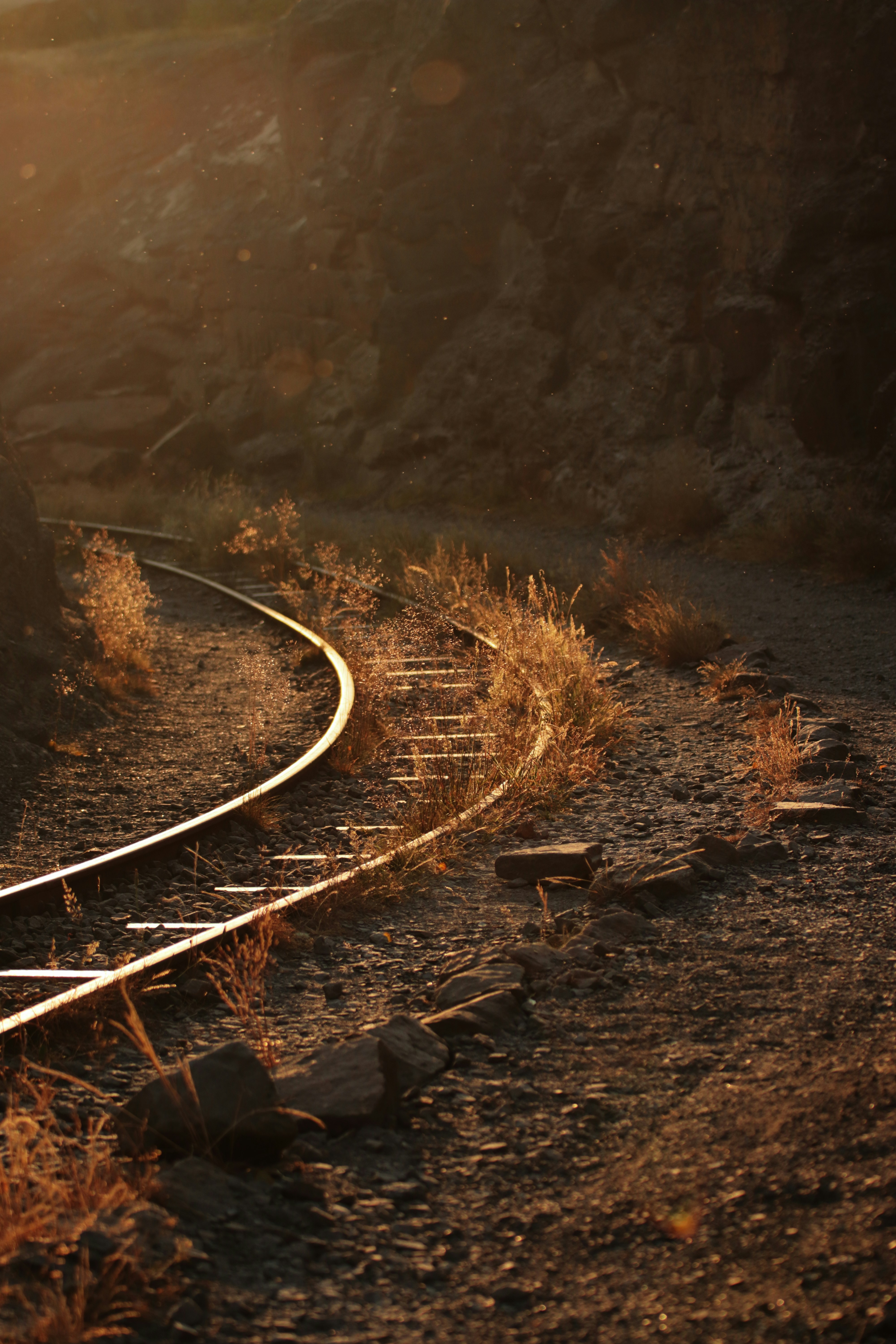 a train track running through a rocky area