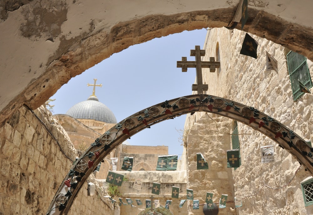 a church with a cross hanging from it's side