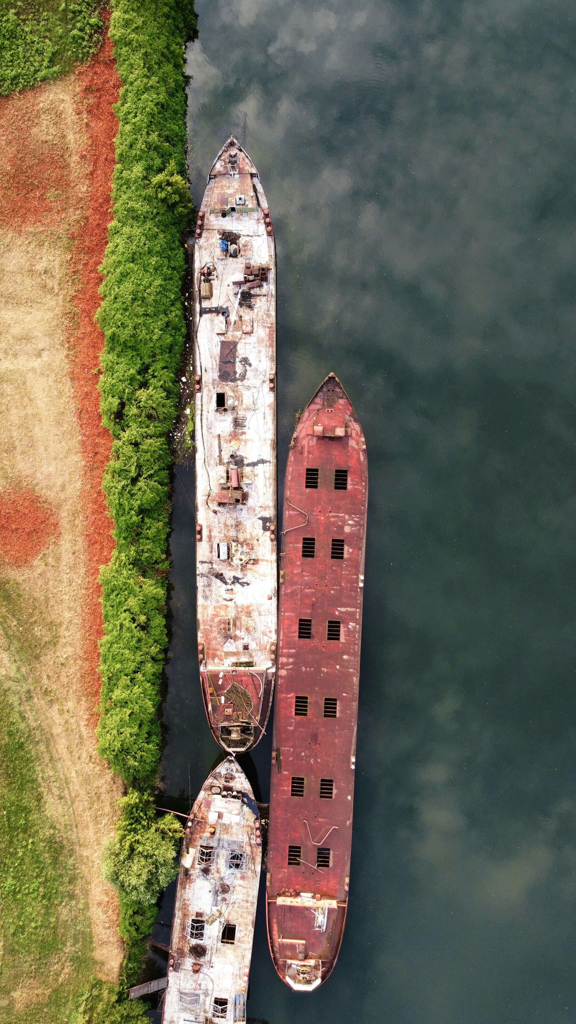 two large boats sitting next to each other in a body of water