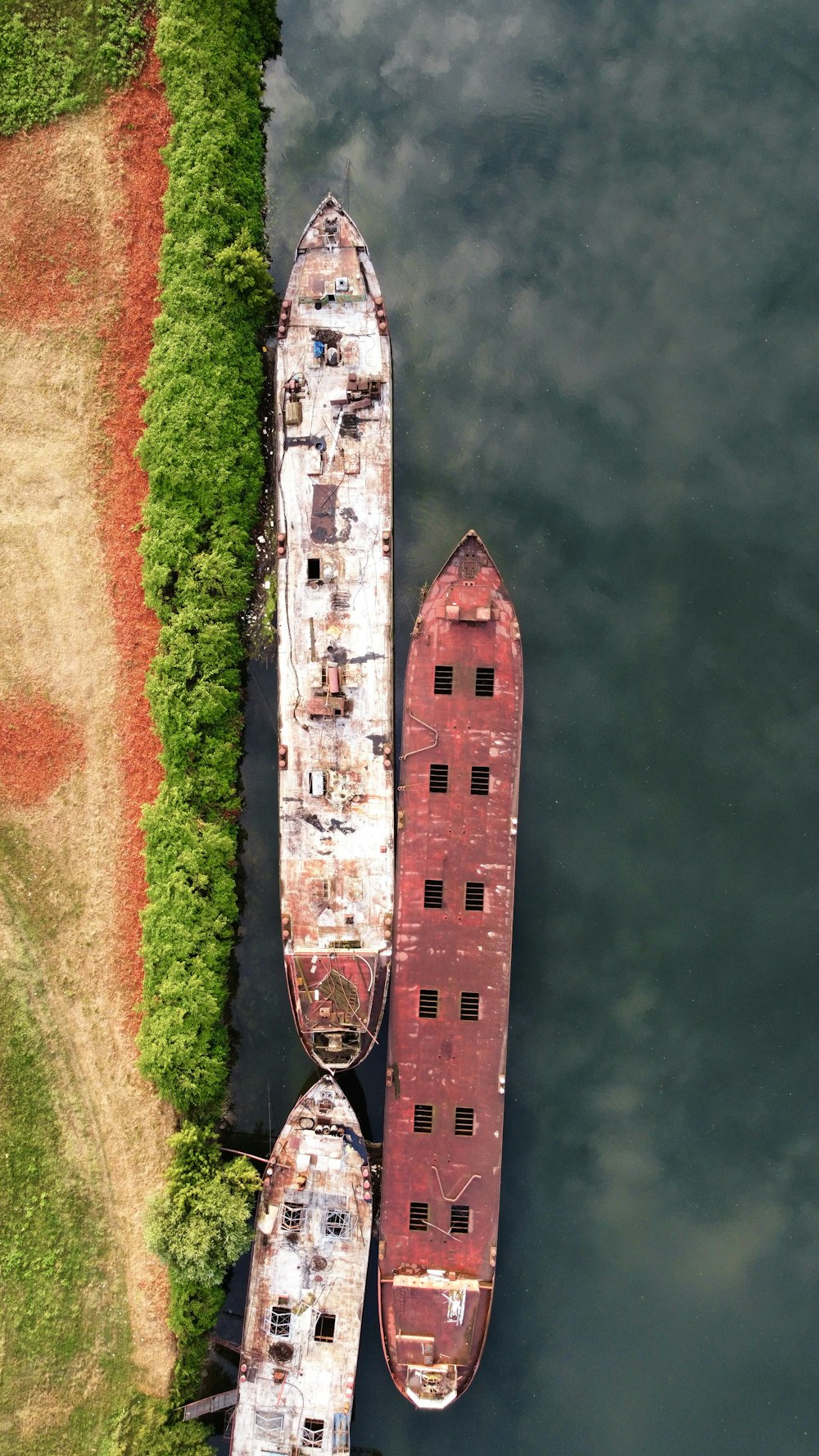 two large boats sitting next to each other in a body of water