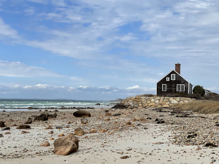 Beach house on Cape Cod sitting directly on the sand by the ocean
