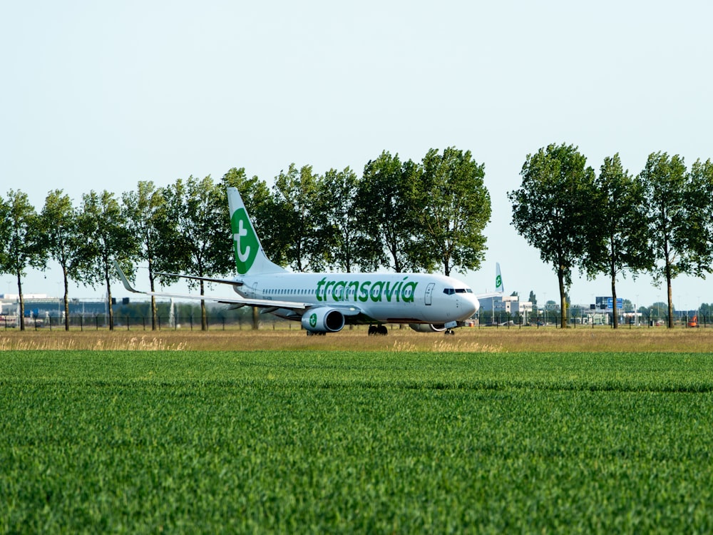 a large passenger jet sitting on top of an airport runway