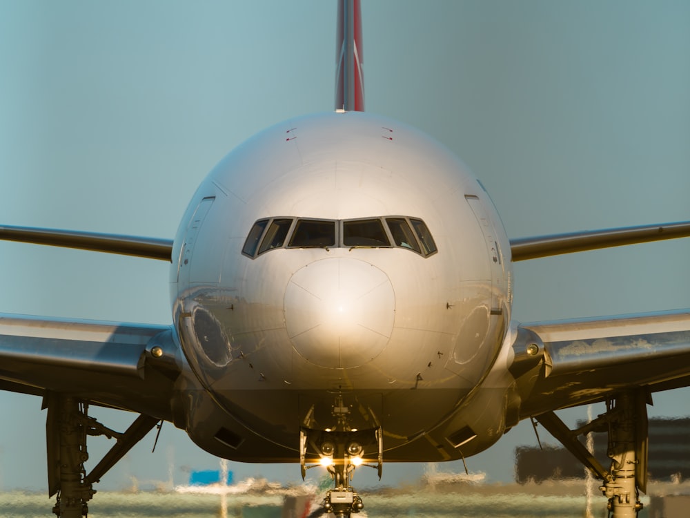 a large jetliner sitting on top of an airport tarmac