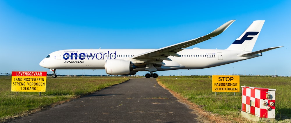 a large jetliner sitting on top of an airport runway