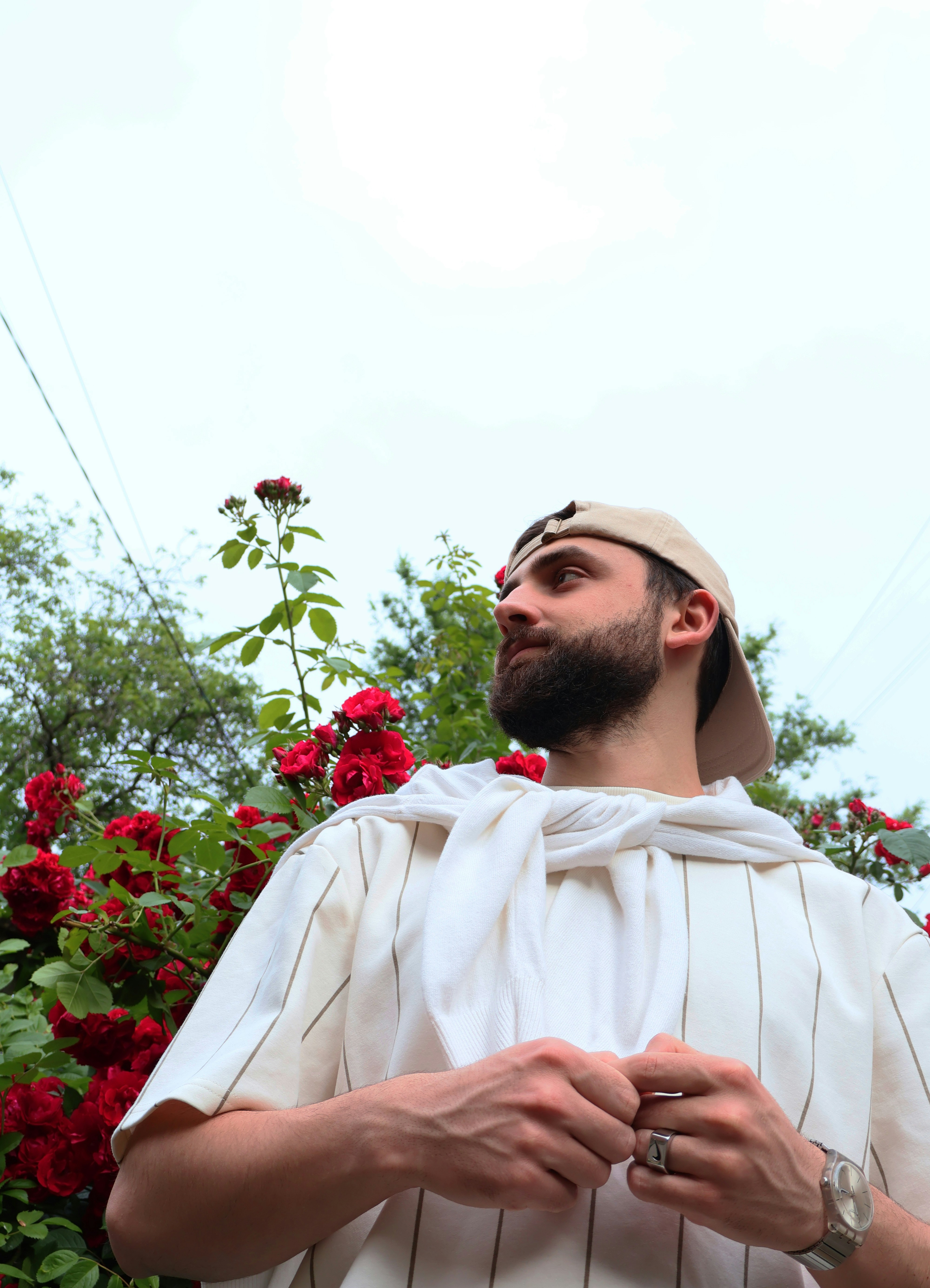 a man with a beard wearing a white shirt