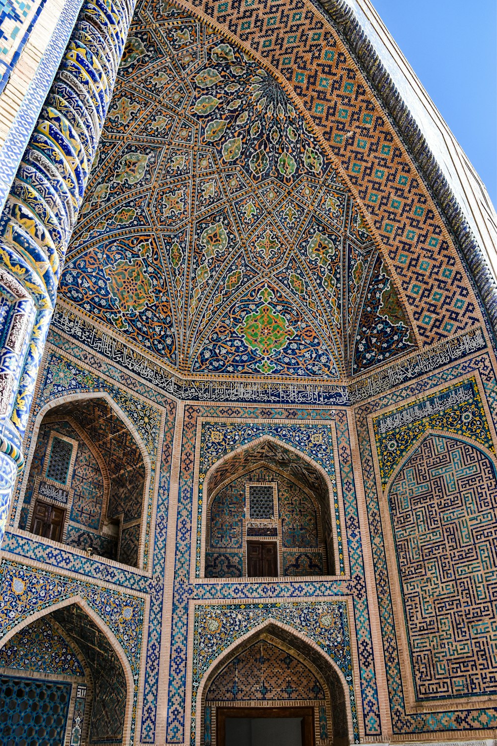 an ornate building with a door and windows