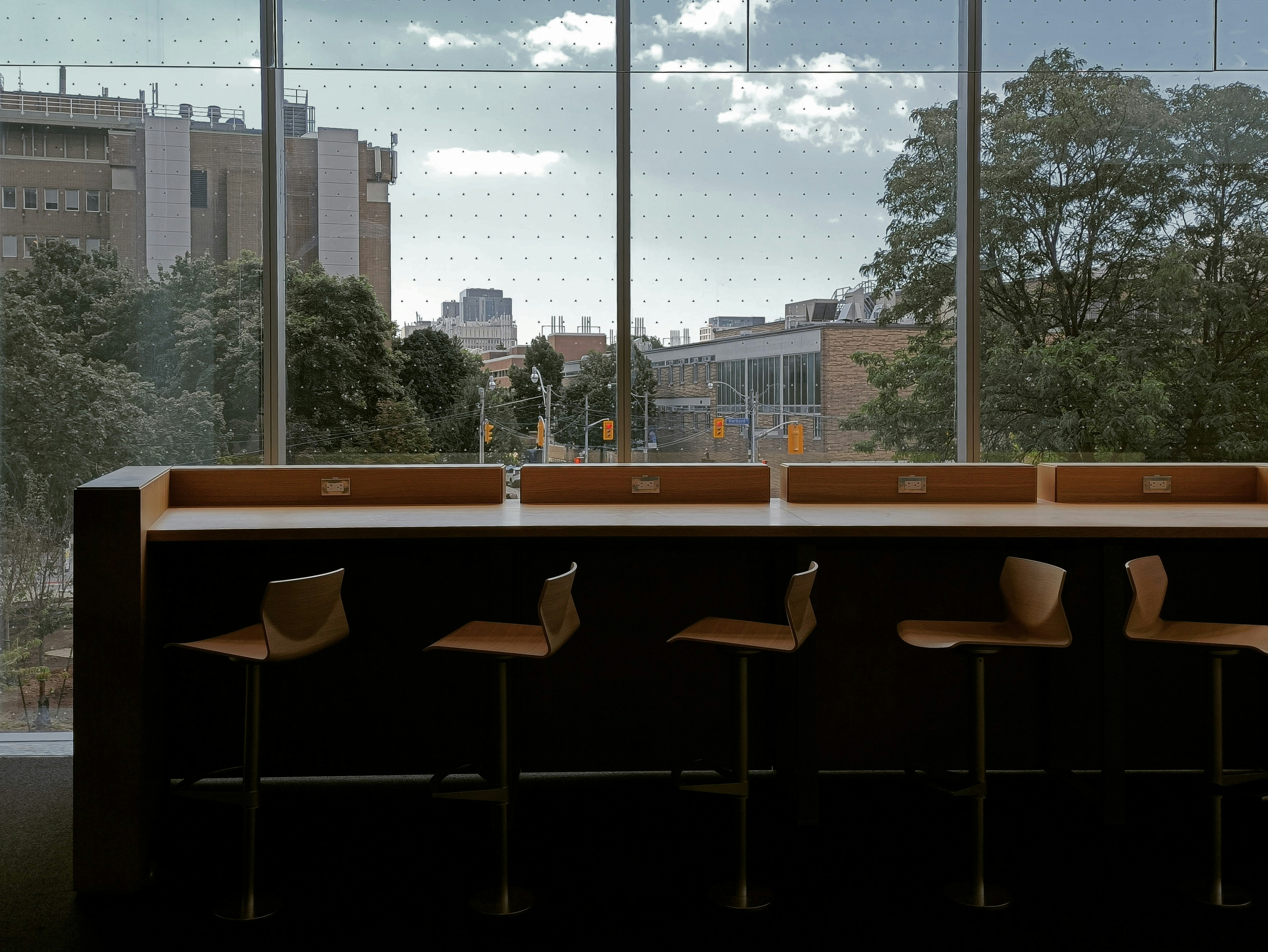 a row of chairs sitting in front of a window