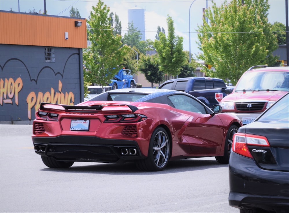 a red sports car parked in a parking lot