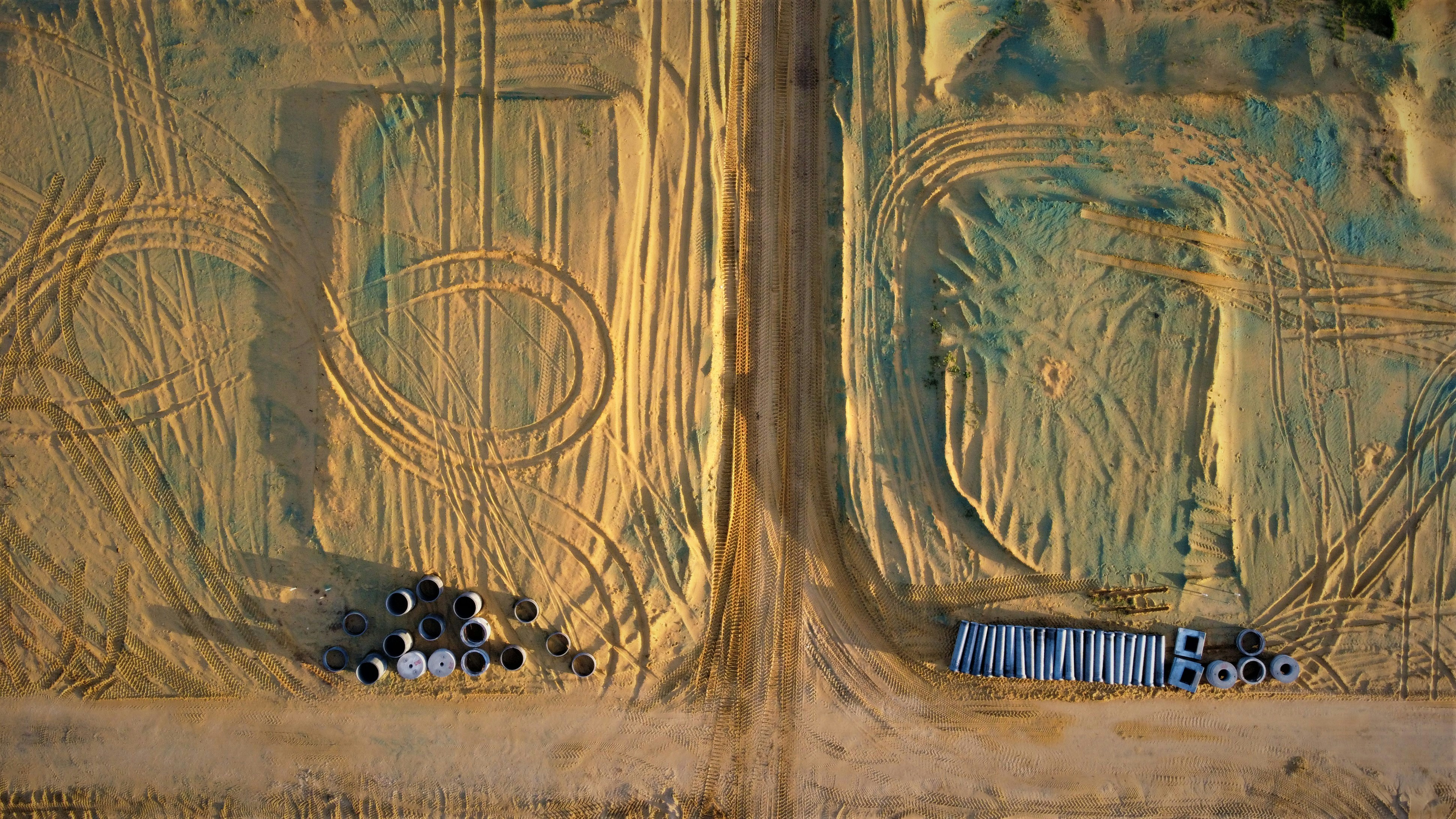 an aerial view of a forest with trees and a truck