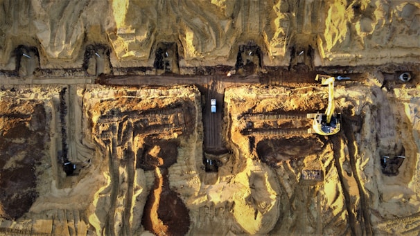 An aerial view of earthworks in progress with excavators.