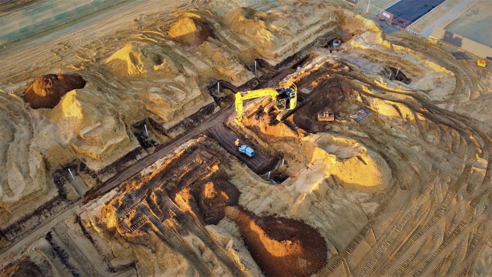 an aerial view of a construction site with a bulldozer