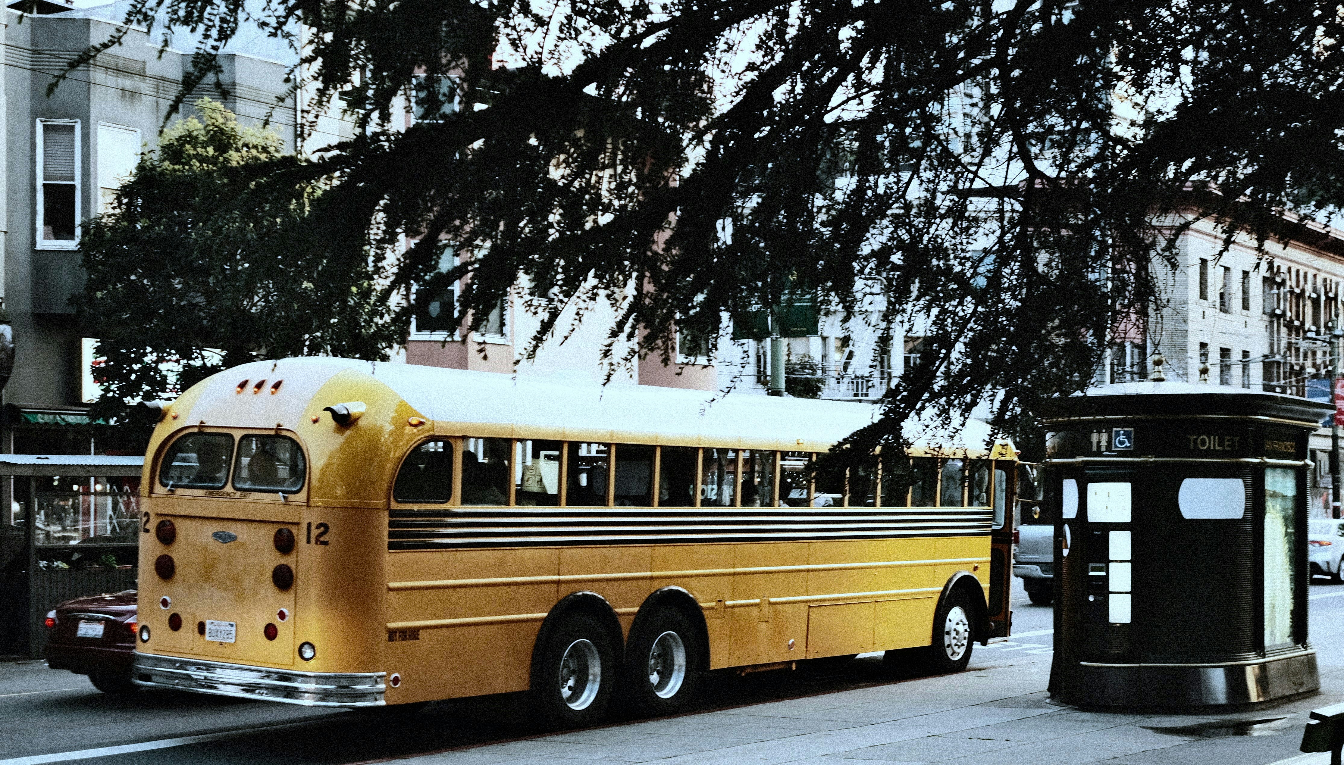 a yellow school bus parked on the side of the road