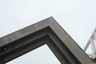 a clock on a tower with a sky background