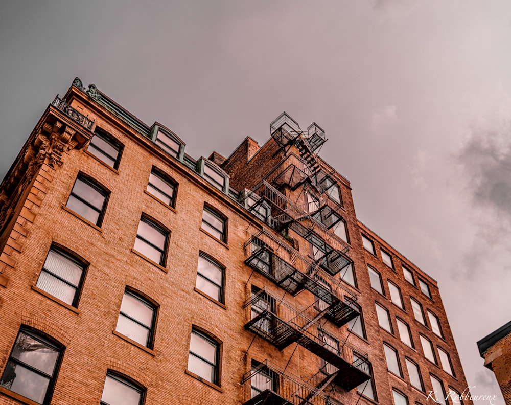 a tall brick building with lots of windows