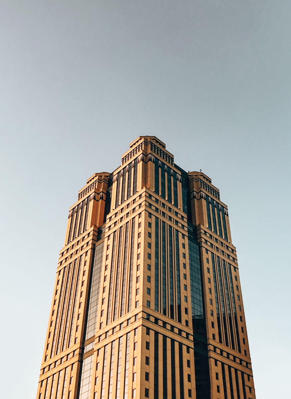 a tall building with a clock on the top of it