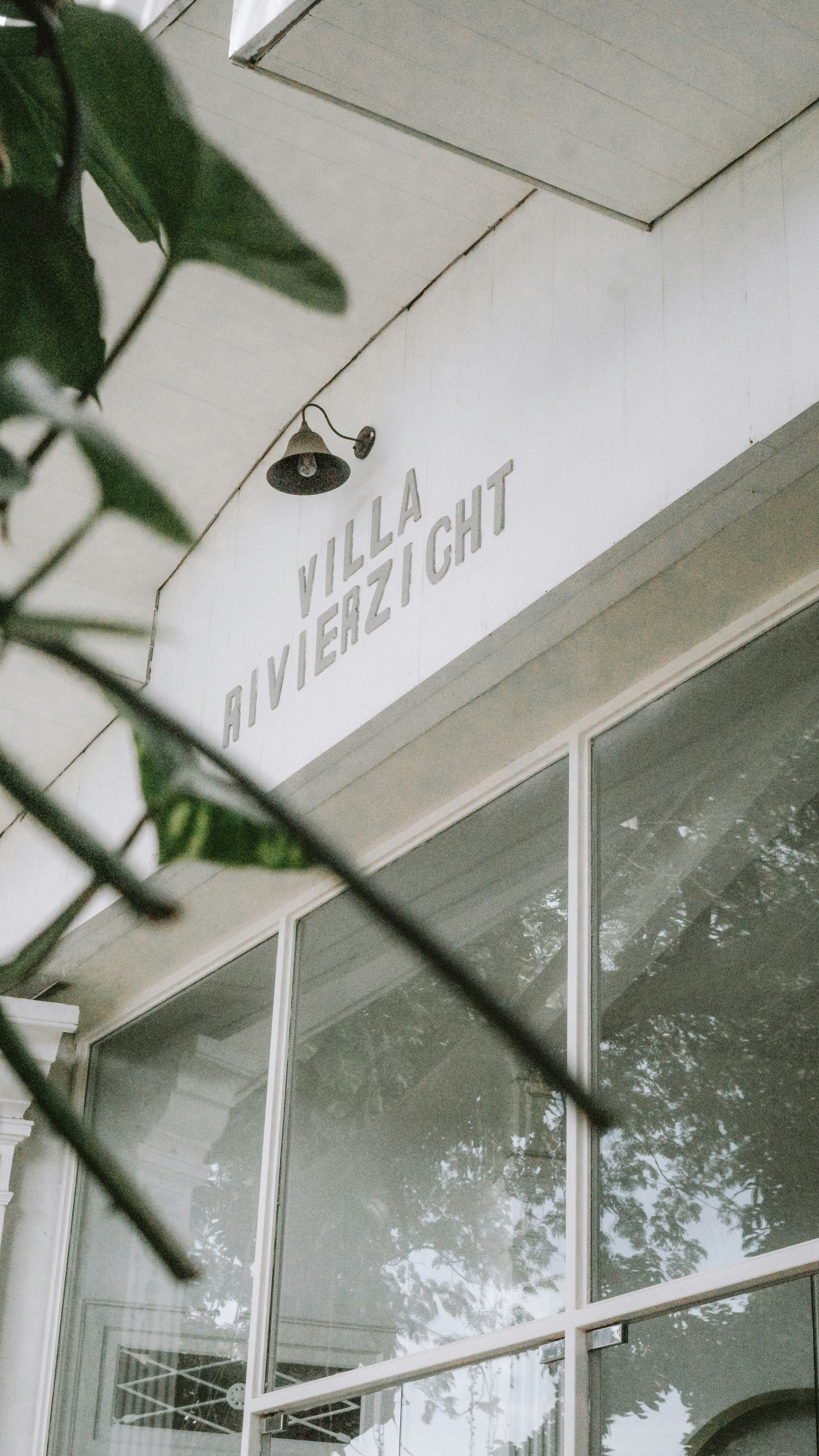 a white building with a sign that says villa rivierzlight