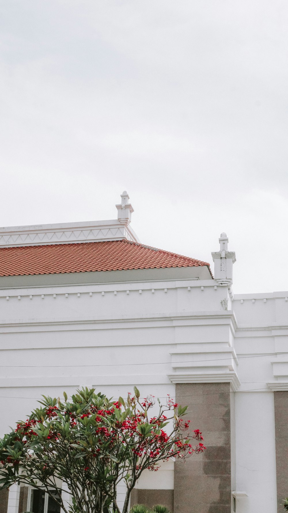 a white building with a clock on the front of it