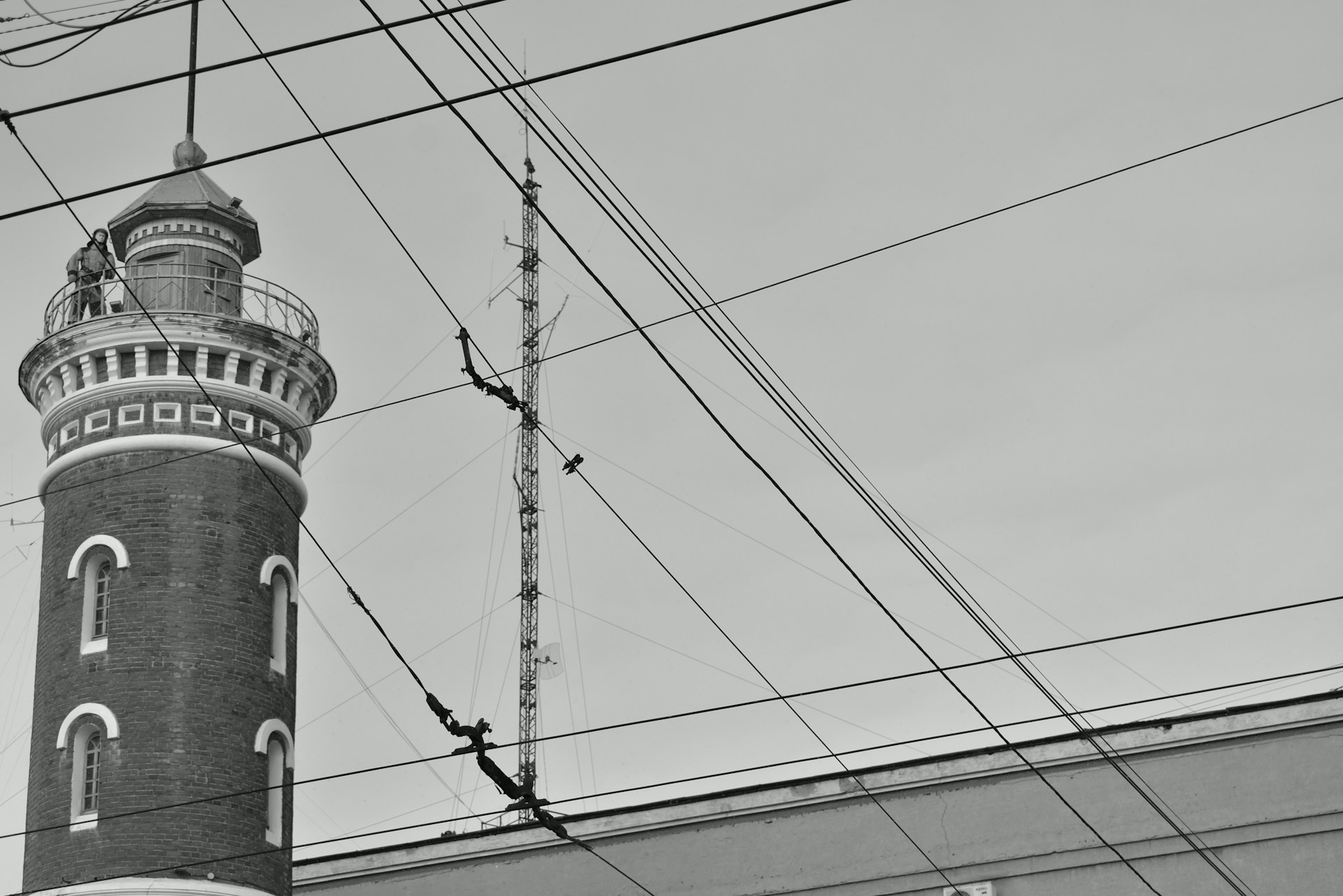 a black and white photo of a tall tower