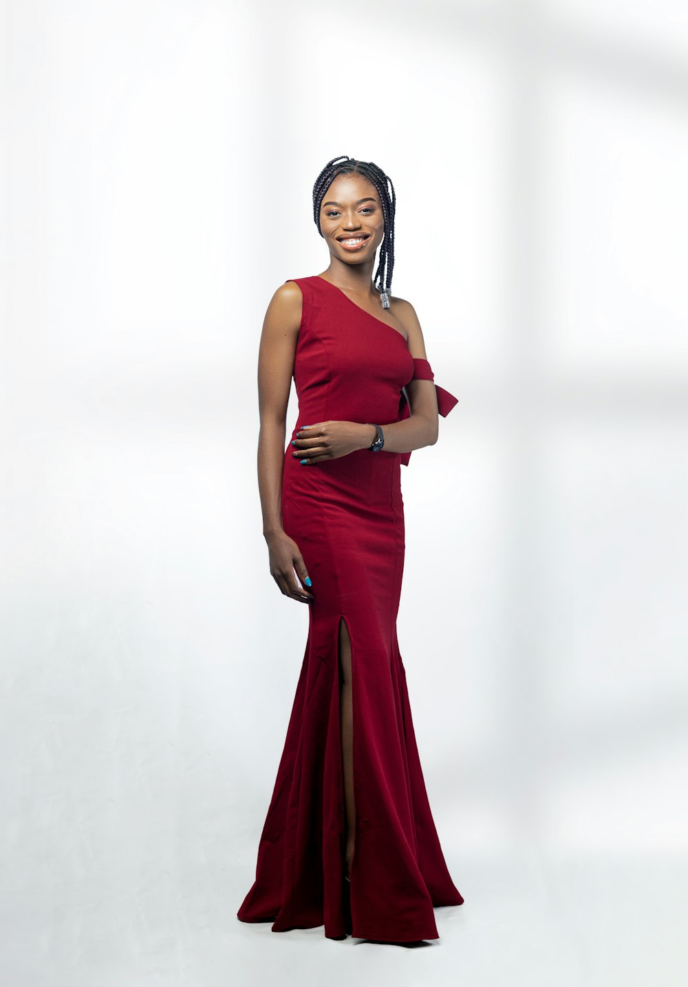 a woman in a red dress posing for a picture