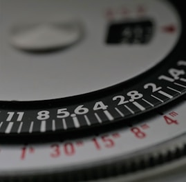a close up of a black and white clock face