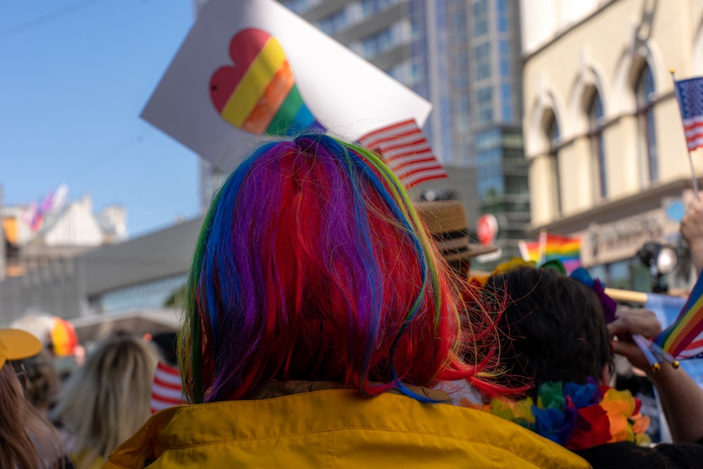 a group of people with rainbow colored hair