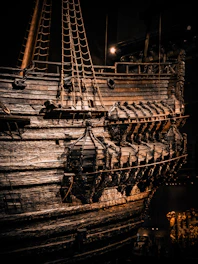 Close-up of a restored wooden vessel showing fine grain and craftsmanship.