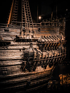 Close-up of a restored wooden vessel showing fine grain and craftsmanship.