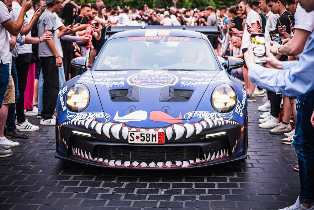 a blue car with a face painted on it