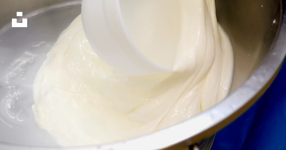 Splashed Batter A person pouring batter into a metal bowl photo – Free Food Image on ...