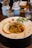 A beautifully arranged plate of Italian pasta with herbs.