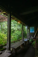 Outdoor covered common area with autor kitchen under soft natural lighting