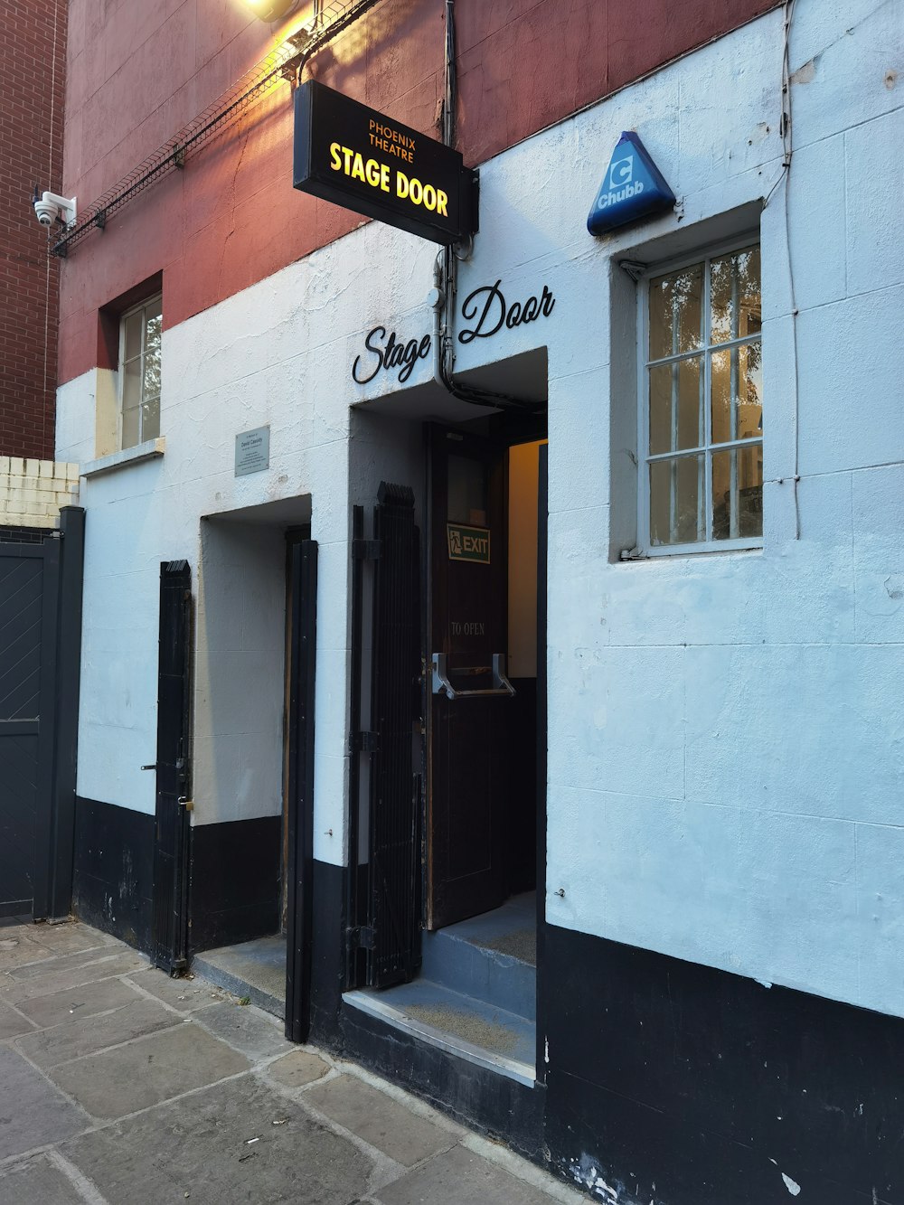 a building with a sign that says stage door