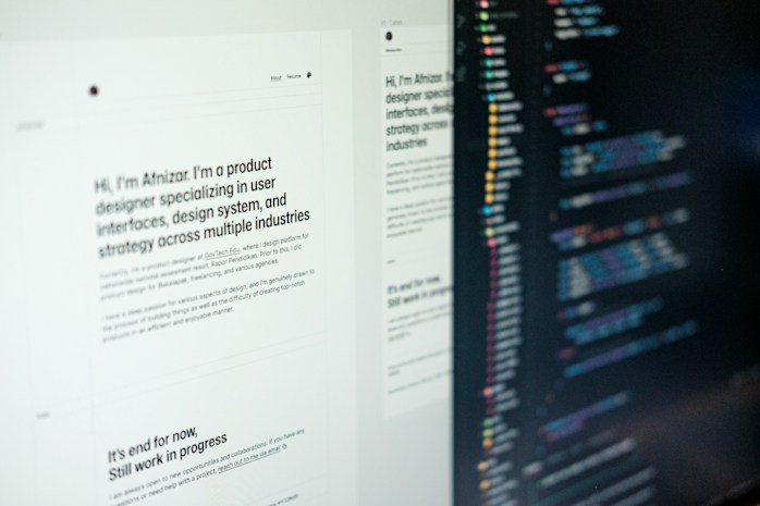A computer screen displaying web design content and code side by side. The left side features text describing a product designer's work and experience, while the right side shows colorful, highlighted code lines on a dark background.